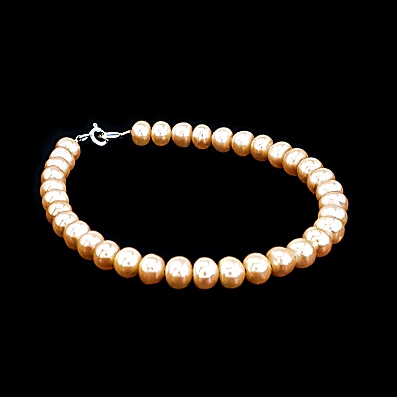 Zapestnica iz biserov marelične barve cca 7mm 2-115